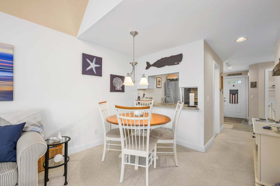 Dining area for four, offering a cozy and comfortable space for meals with a simple, inviting setup ideal for everyday dining