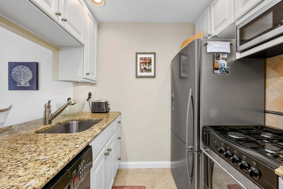 Fully equipped kitchen with all essential cookware and utensils, designed for convenient home cooking and entertaining.