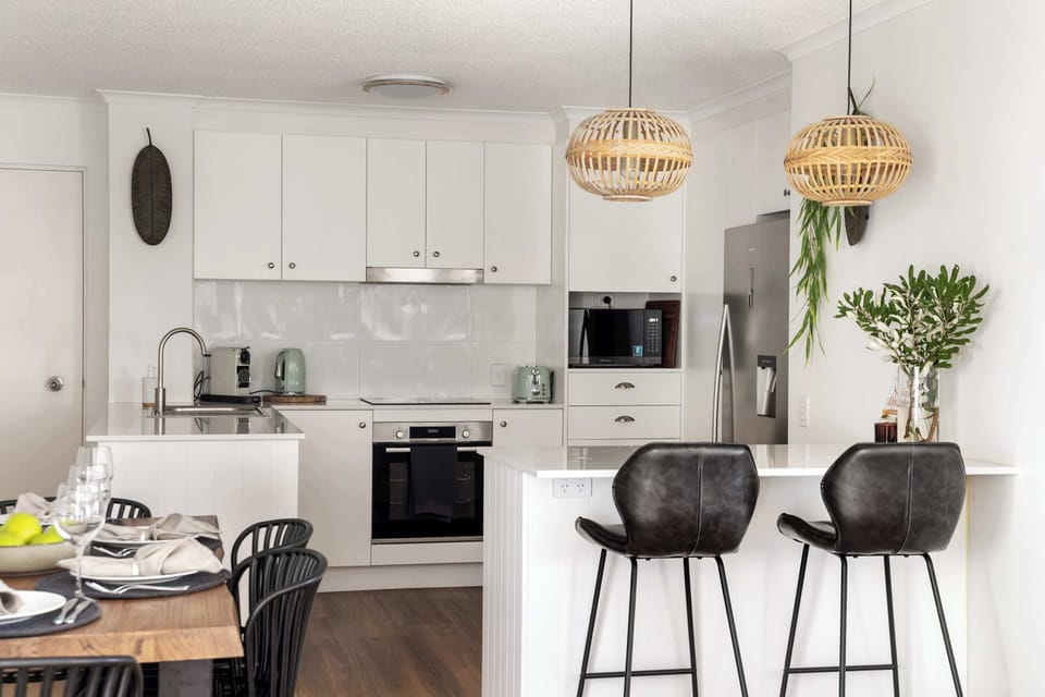 Open-plan living and dining with coastal-luxe finishes, designed for relaxed family meals and effortless entertaining.
