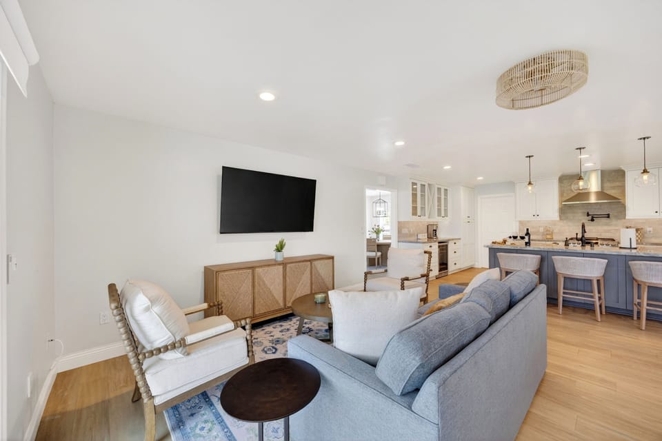 A charming formal dining nook situated just off the kitchen, perfect for intimate family meals and morning coffee.