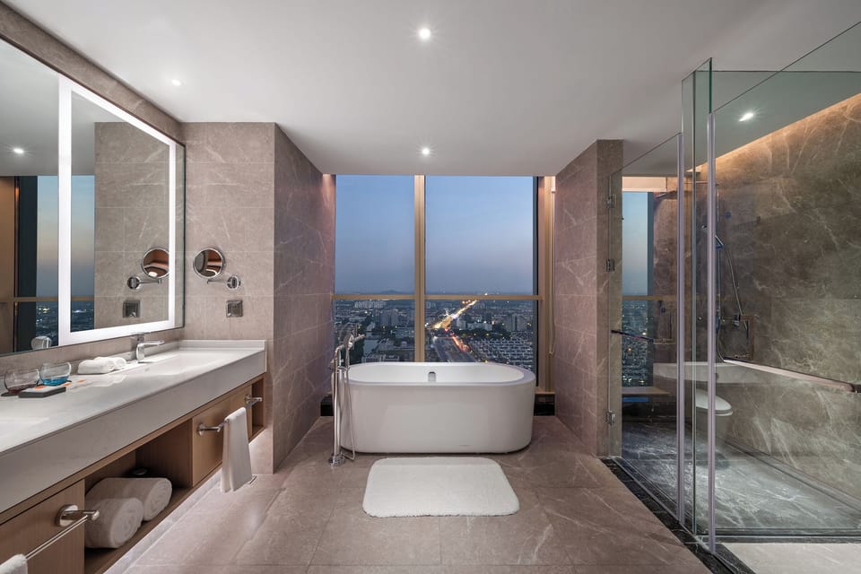 Executive Suite, Private Bathroom | Bathroom | Hair dryer, slippers, towels, soap