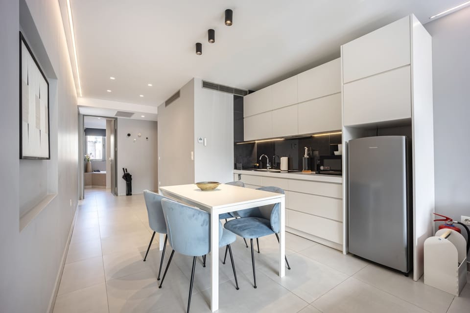 Prepare meals effortlessly in a modern kitchen paired with a stylish dining area for gatherings.