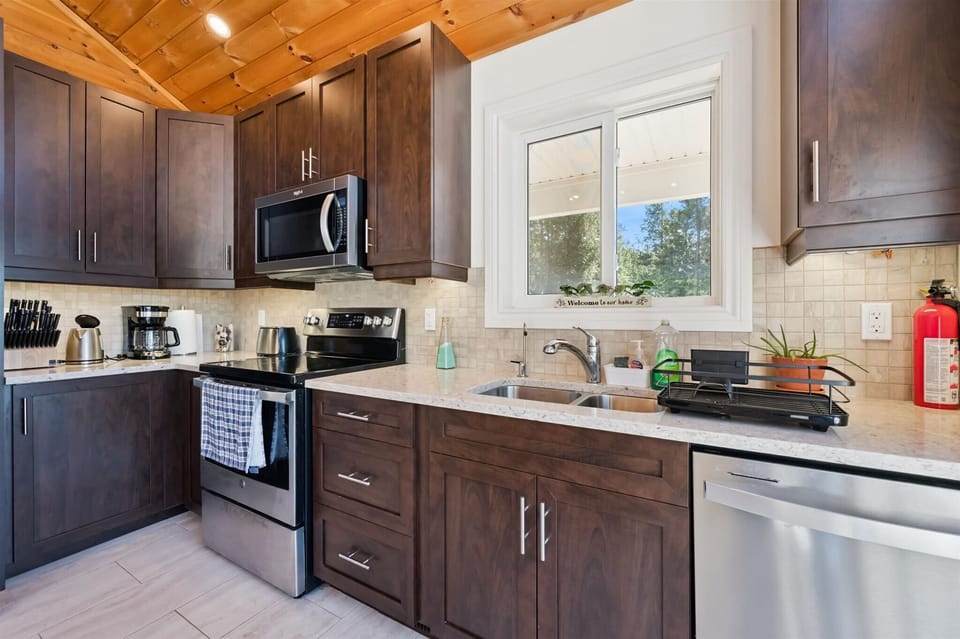 Thoughtfully designed with contemporary finishes, the kitchen offers everything needed for home-cooked meals during your stay.
