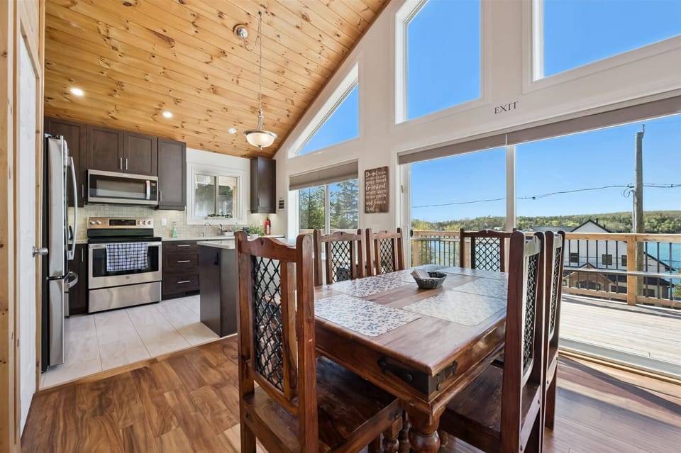Enjoy meals with a view in the sun-filled dining area overlooking the surrounding landscape and water.