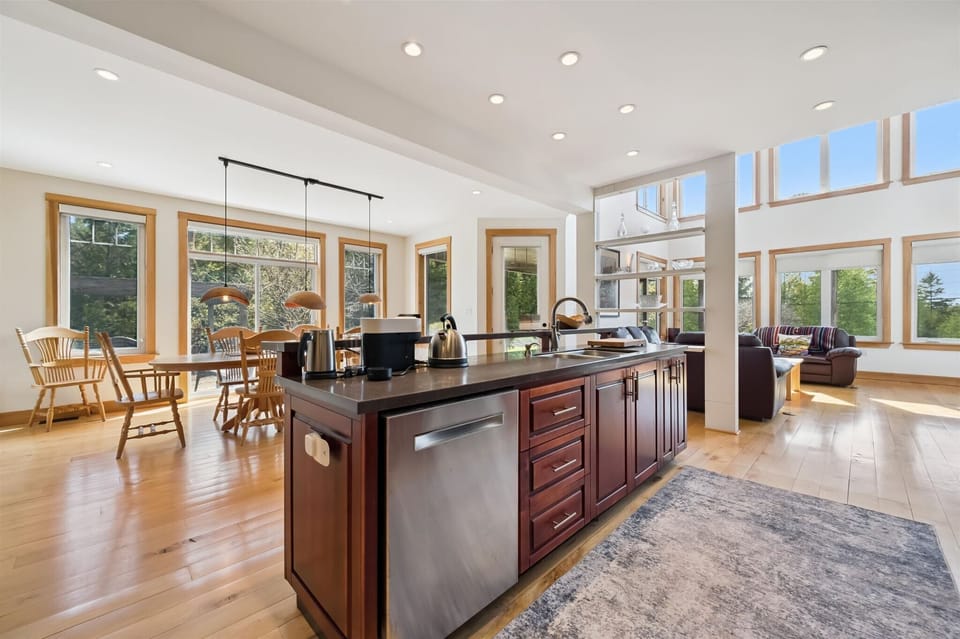 Expansive chef’s kitchen with large island and open-concept layout.