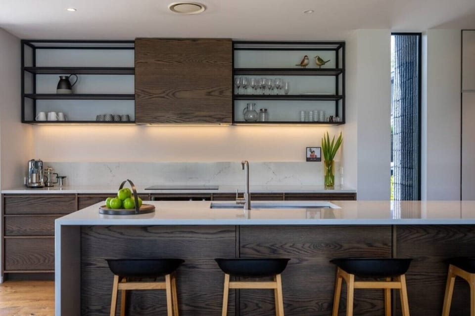 Gather around your sleek kitchen island with waterfall counters and prep your favorite meals on the gas cooktop”