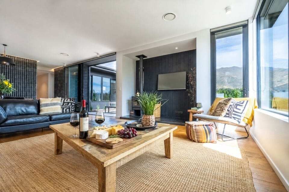 Unwind with your favorite wine while watching the sunset paint the mountains through floor-to-ceiling windows