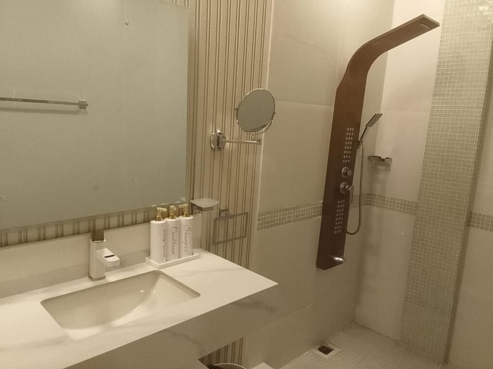 Panoramic Quadruple Room, Balcony, Sea View | Bathroom | Slippers, bidet
