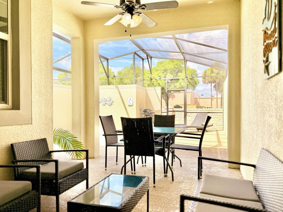 Cooling fan, pool dining, and patio seating. This will be your favorite spot