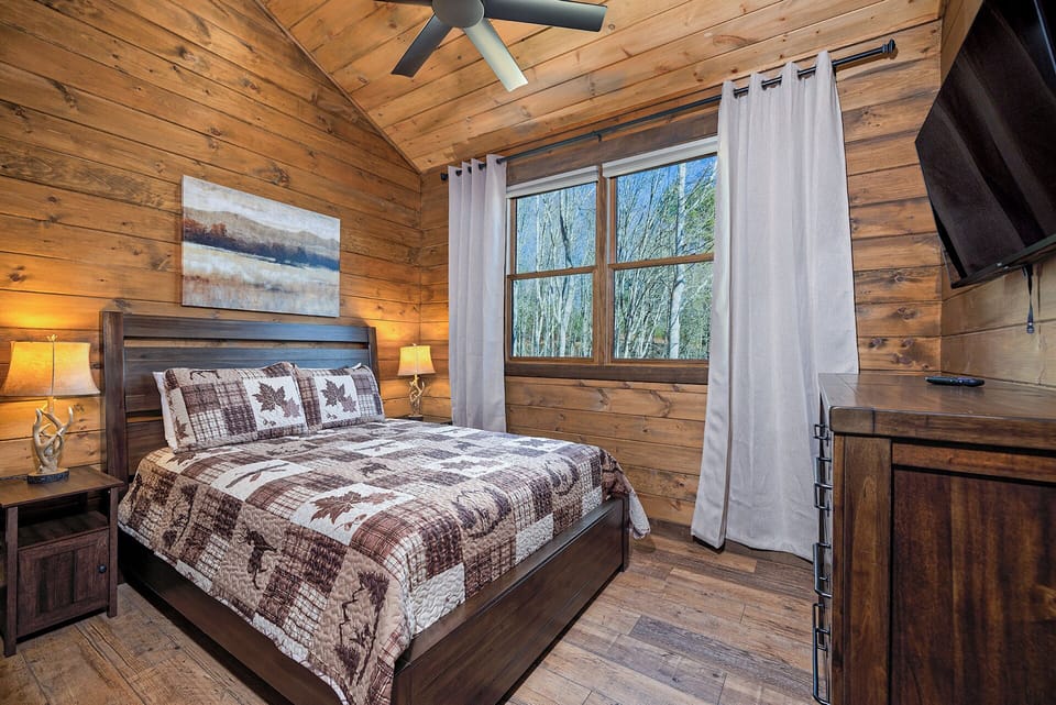 Queen size bed in the 3rd bedroom, also on second level