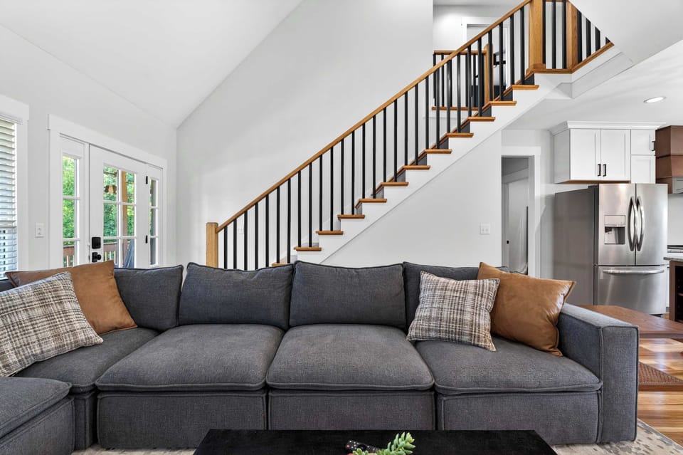 Living Area: This cozy living area offers plush seating, plenty of natural light, and a comfortable space to enjoy movie nights or quiet evenings.