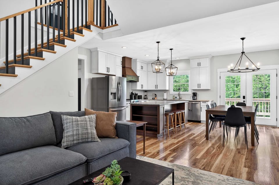 Living Area: This cozy living area offers plush seating, plenty of natural light, and a comfortable space to enjoy movie nights or quiet evenings.