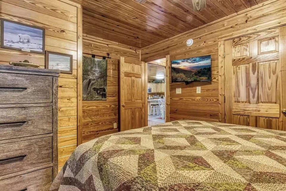 Main level bedroom right of hallway with full bath adjacent