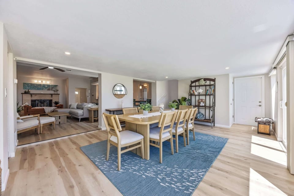 Spacious dining area with natural light and modern wood flooring.