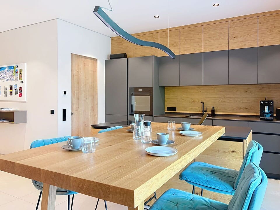 Furniture, Interior Design, Flooring, Kitchen, Floor, Light Fixture, Wood, Countertop, Ceiling, Chair