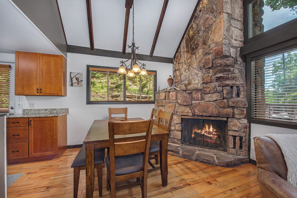 Gather around the table by your own crackling fireplace, framed by soaring beamed ceilings and natural light—perfect for cozy meals and warm conversations after mountain adventures.