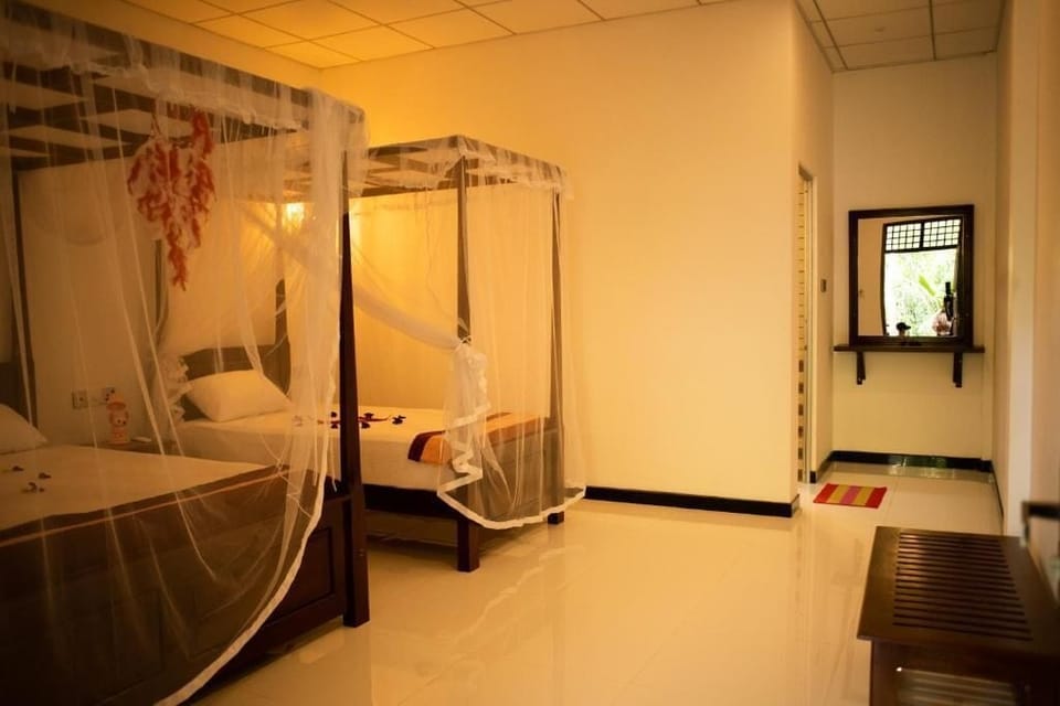 Deluxe Triple Room, Balcony, Garden View | In-room safe, soundproofing, iron/ironing board, free WiFi