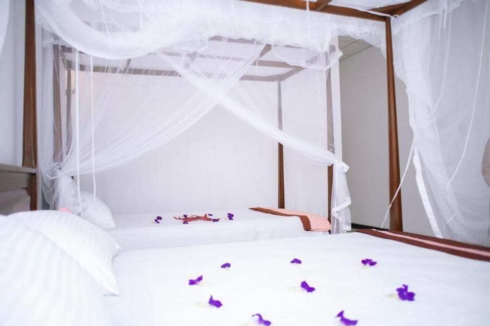 Deluxe Triple Room, Balcony, Garden View | In-room safe, soundproofing, iron/ironing board, free WiFi