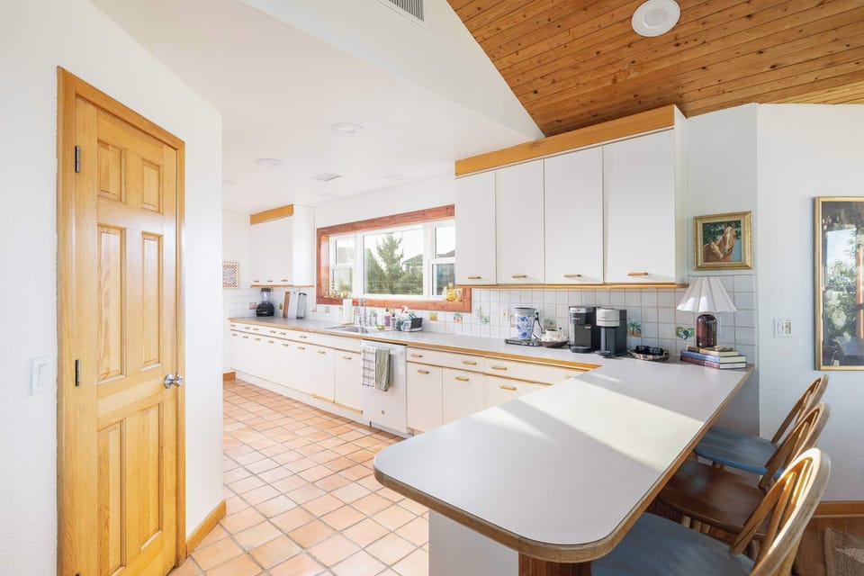 Top Level Kitchen & Breakfast Bar with seating, perfect for casual meals and morning coffee