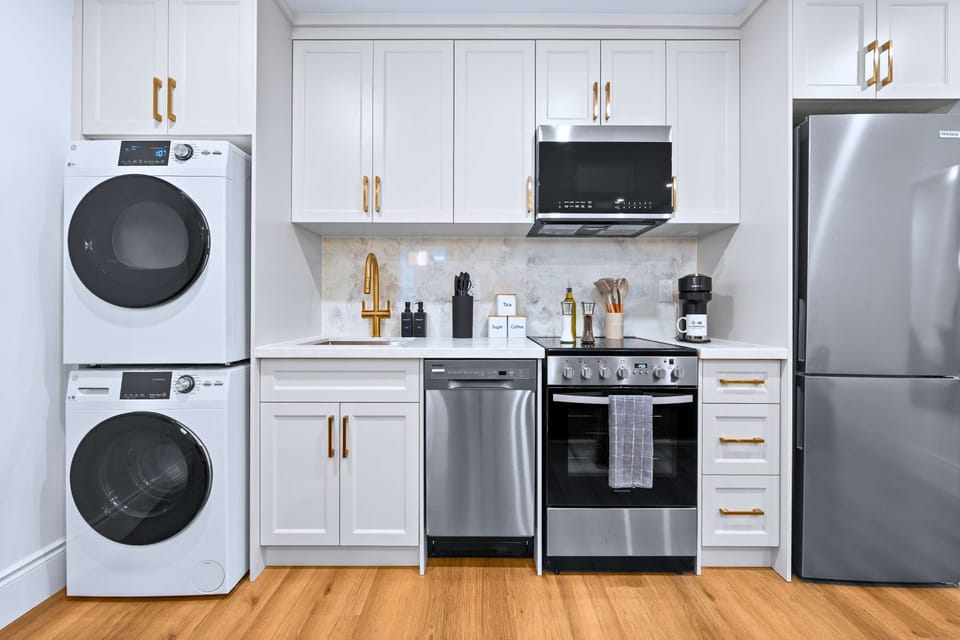 Fully equipped kitchen with in suite laundry ready for an effortless stay.