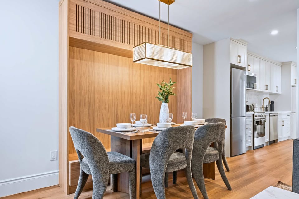 Dining space linking kitchen and living for group comfort.
