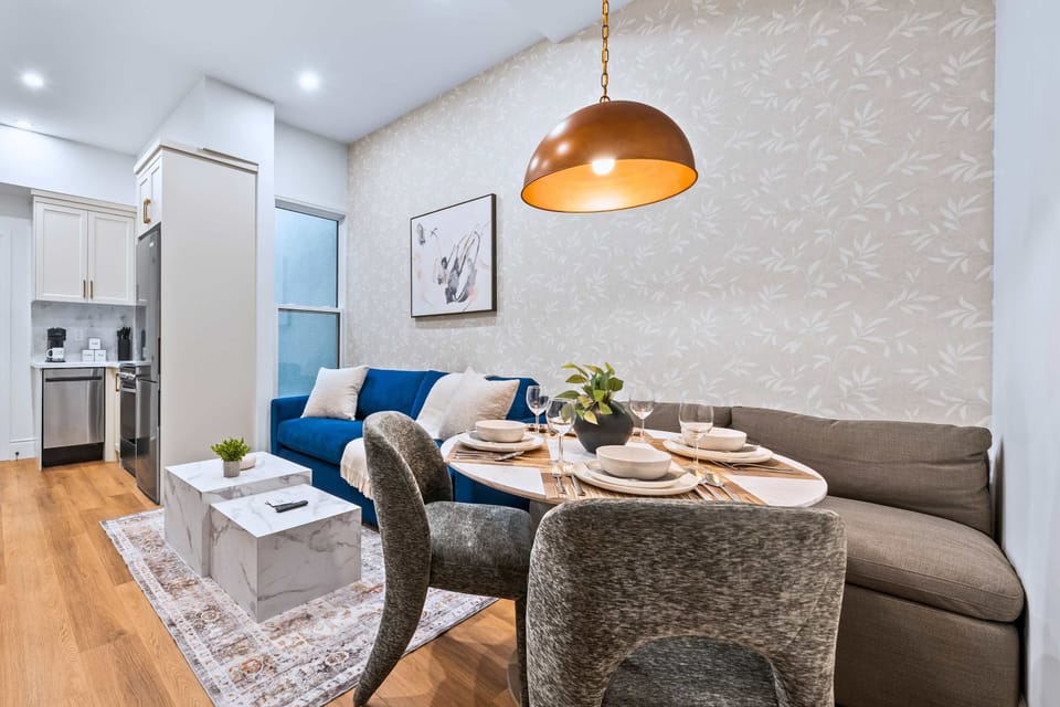 Open living, dining, and kitchen space designed for cooking, sharing meals, and spending time together