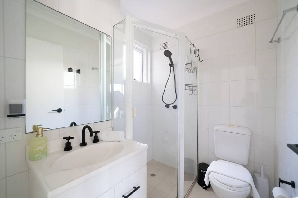 Refresh in the primary bedroom's ensuite, where bright finishes and a walk-in shower create a simple, comfortable space to start and end the day.