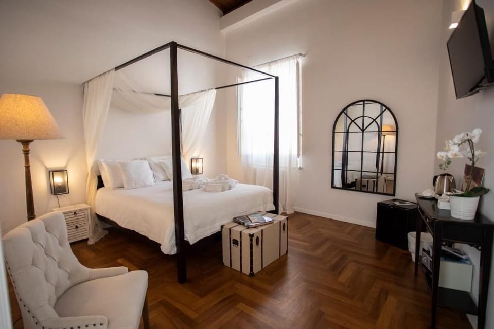 Deluxe Quadruple Room, City View | In-room safe, blackout drapes, iron/ironing board, free WiFi