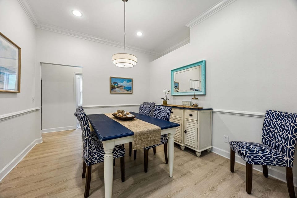 The dining table can fit 6 people comfortably for meals.