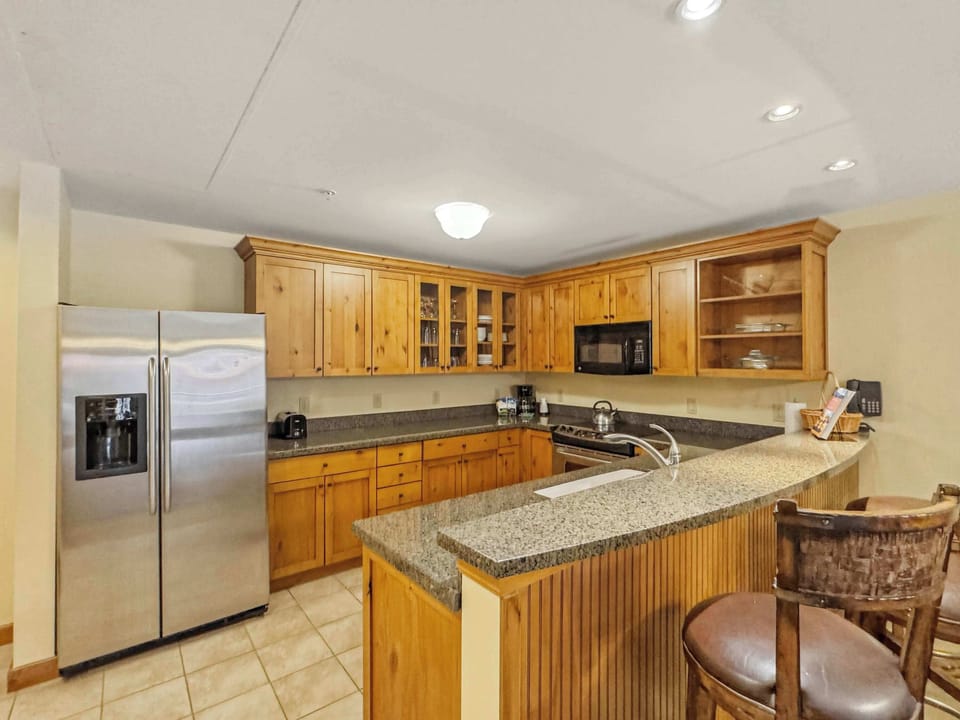 Open Concept Kitchen with Bar seating for the family | Listed with @BookTraverse
