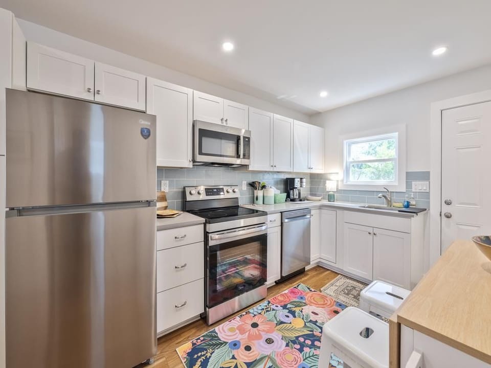 Sleek appliances and stylish layout invite cooking.