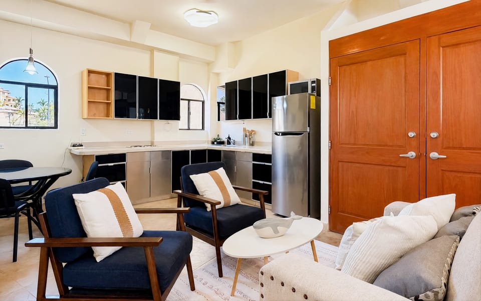 View of the living, dining, and kitchen areas.