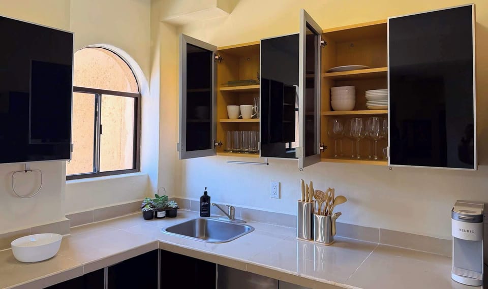 Fully stocked with cookware, blender, toaster, and more.