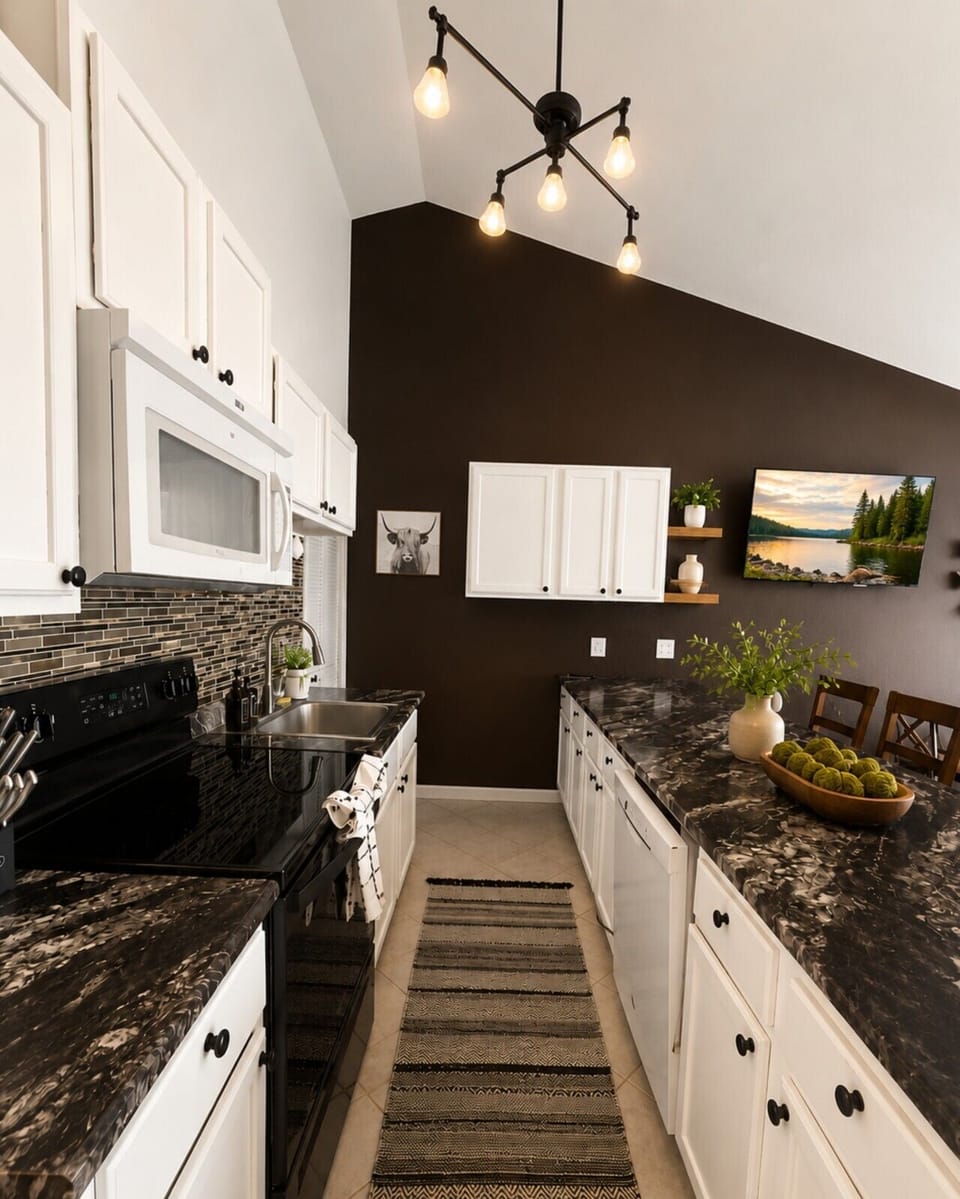 A fully equipped kitchen with modern appliances and plenty of counter space — everything you need to cook up a lakeside meal.
