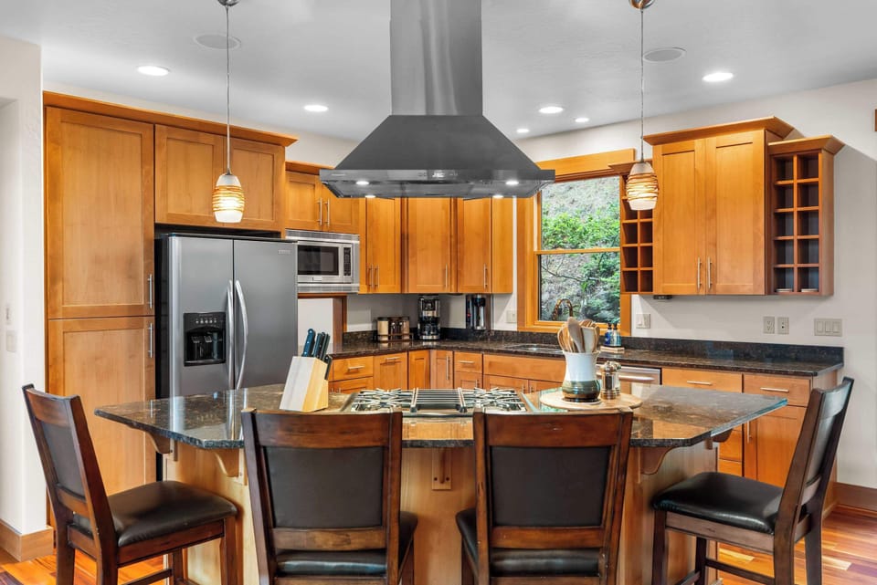Gather around the oversized island while preparing meals and making memories.