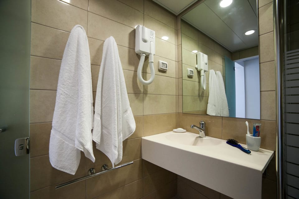 Shower, free toiletries, hair dryer, towels