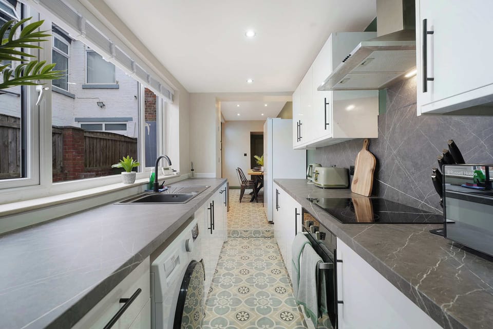 A spacious kitchen designed for effortless self-catering, complete with modern appliances, generous storage, and ample preparation space. Perfect for everything from quick breakfasts to family dinners during your stay.