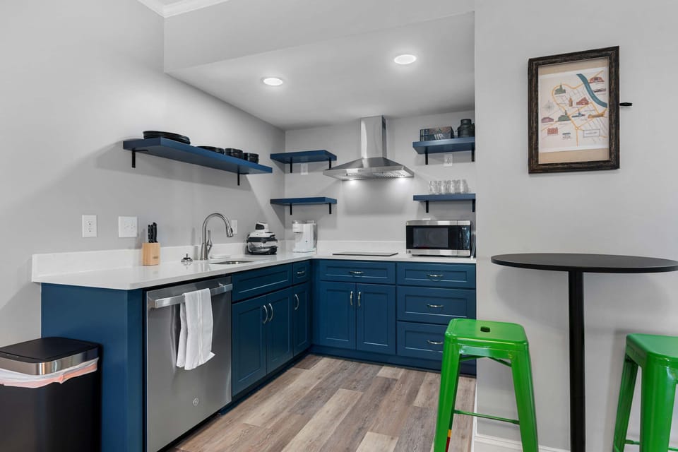 Kitchen equipped with gas stove, toaster, coffee makers, air-frier, and more.