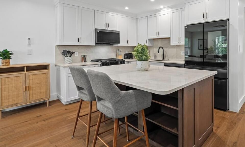 Bright, modern kitchen with a spacious island, bar seating, and everything you need for easy meals at home.