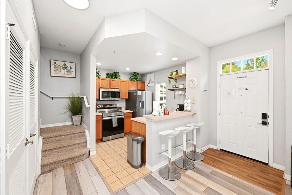 Welcoming Entryway with Open Kitchen & Living Layout