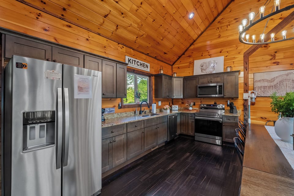 Modern kitchen with granite counters and stainless steel appliances. 