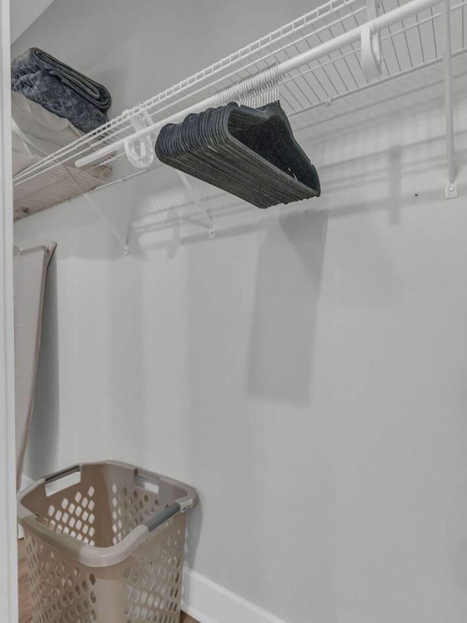 Storage Space: Stay organized with top-notch shelving and a handy laundry basket at your service!