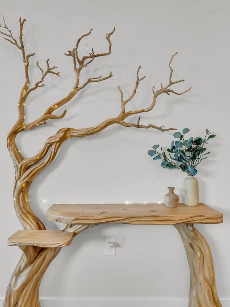 Entryway: Stunning live-edge table adorned with earthy decor sets a warm, inviting tone!