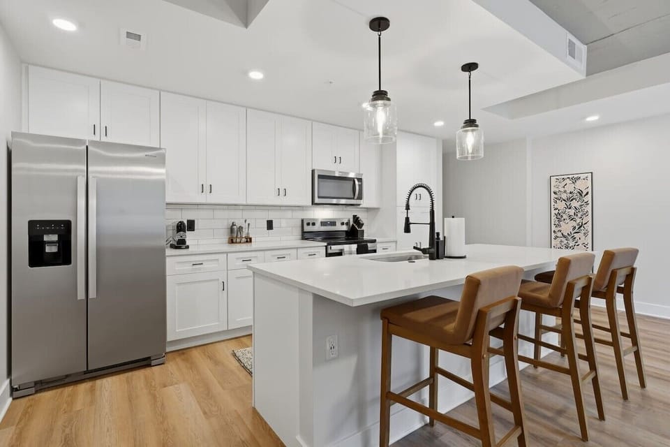 Kitchen: Bright and airy space with modern fixtures, perfect for culinary adventures and gatherings!