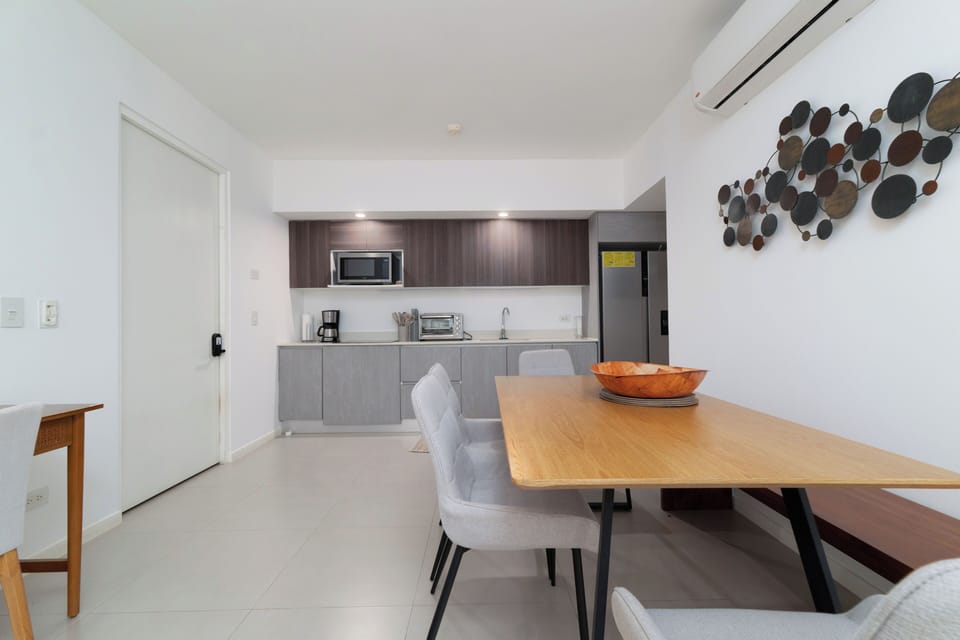 Full-size fridge, microwave, cookware/dishes/utensils