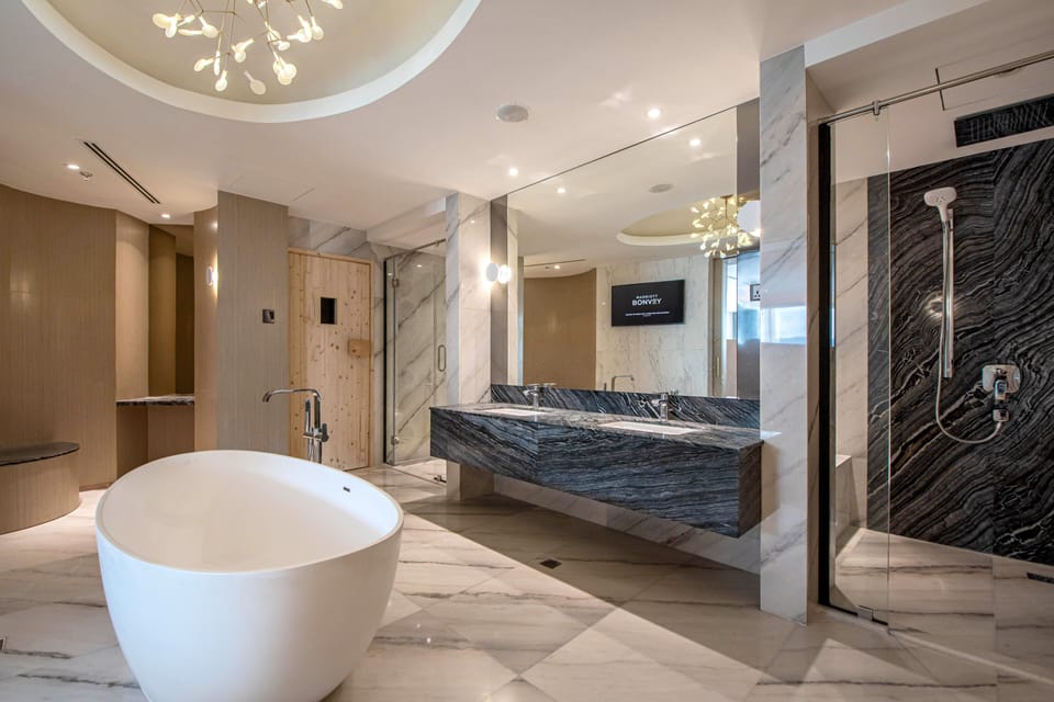 Presidential Suite, 2 Bedrooms | Bathroom | Separate tub and shower, rainfall showerhead, designer toiletries