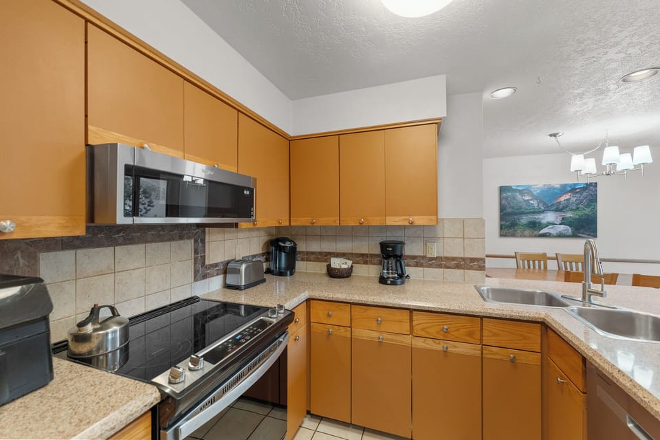 Your fully equipped kitchen features granite counters, modern appliances, and everything you need to prepare meals during your stay.