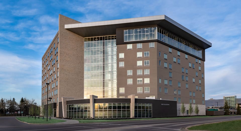 Modern building with large windows and distinctive architectural design.