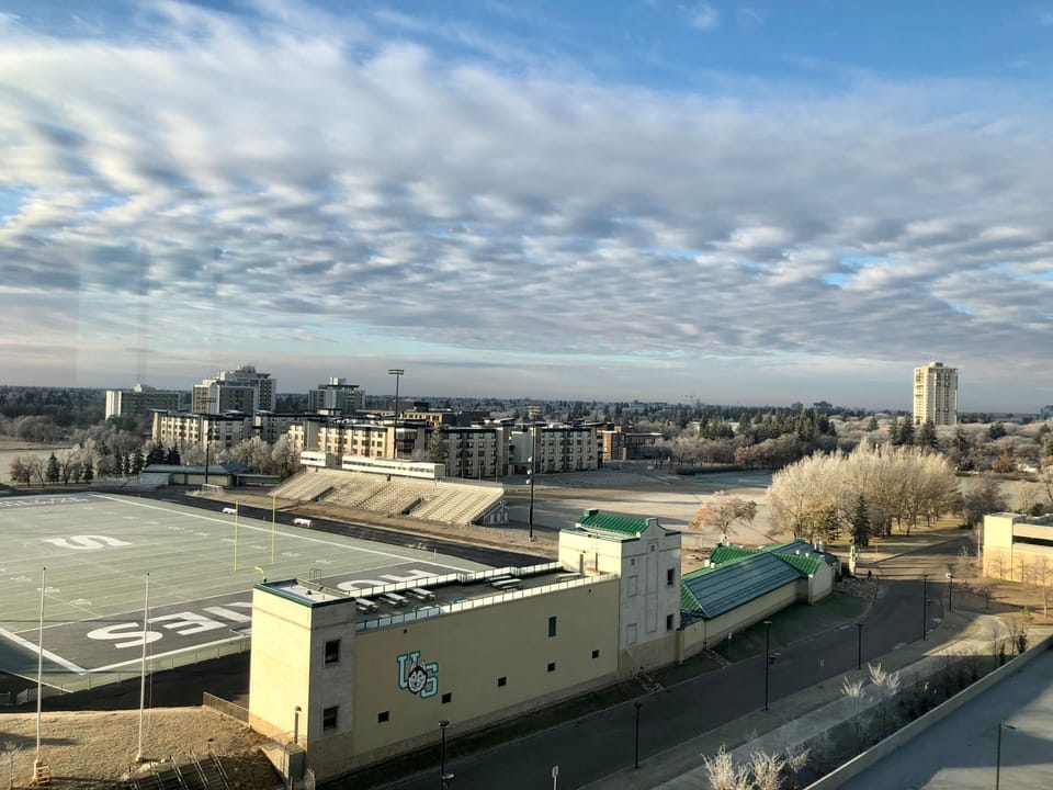 Scenic view of nearby sports fields and campus buildings.