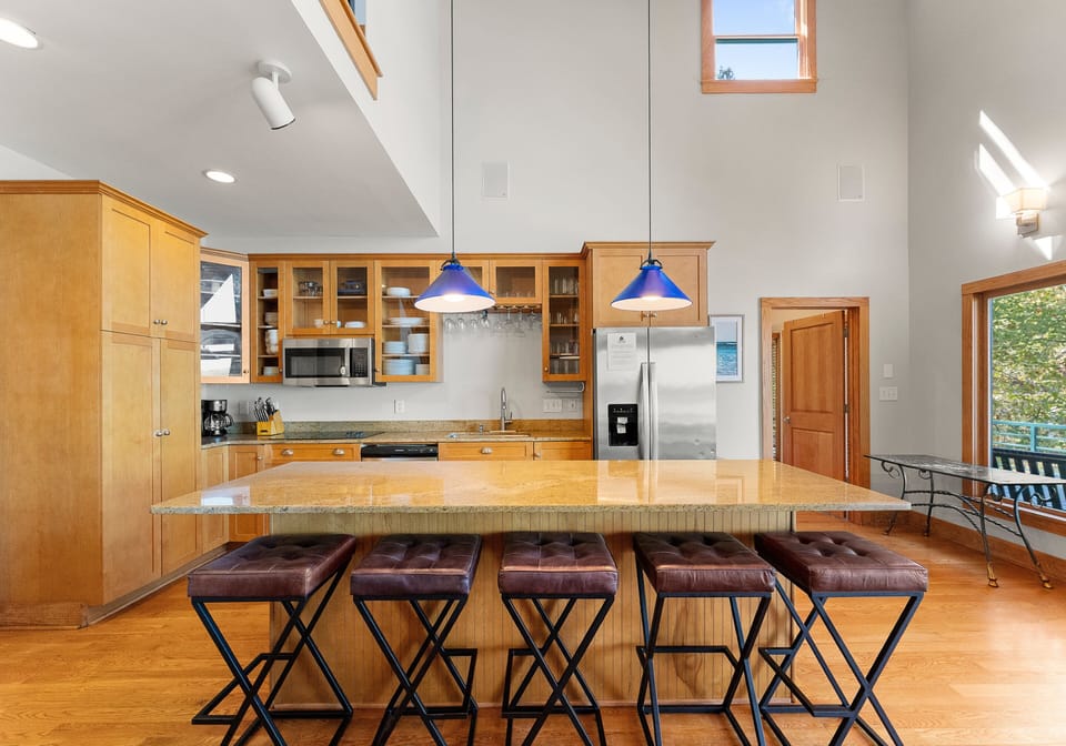 Fully stocked kitchen to prep all your group meals with island seating for 5.